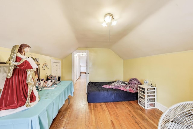5042 W Wolfram St, Chicago, IL 60641 - bedroom with wood finished floors and vaulted ceiling