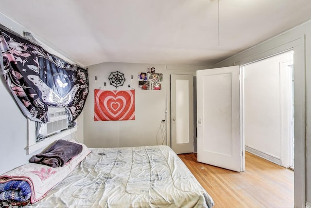 5042 W Wolfram St, Chicago, IL 60641 - bedroom featuring light wood-type flooring and vaulted ceiling