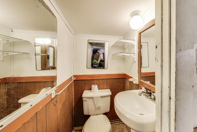 5042 W Wolfram St, Chicago, IL 60641 - half bath with a wainscoted wall and a sink