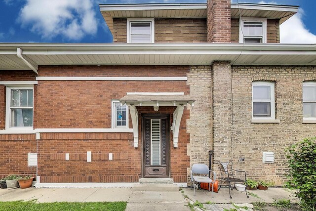 5042 W Wolfram St, Chicago, IL 60641 - doorway to property with brick siding
