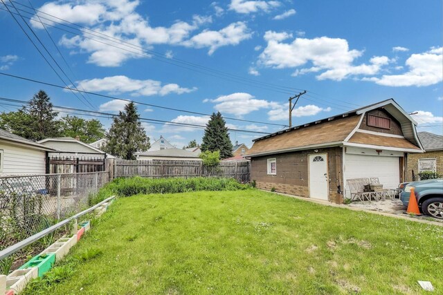 5042 W Wolfram St, Chicago, IL 60641 - view of yard with an outbuilding and a garage