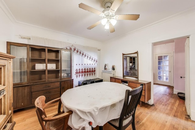 5042 W Wolfram St, Chicago, IL 60641 - dining space featuring light wood-type flooring, crown molding, and a ceiling fan