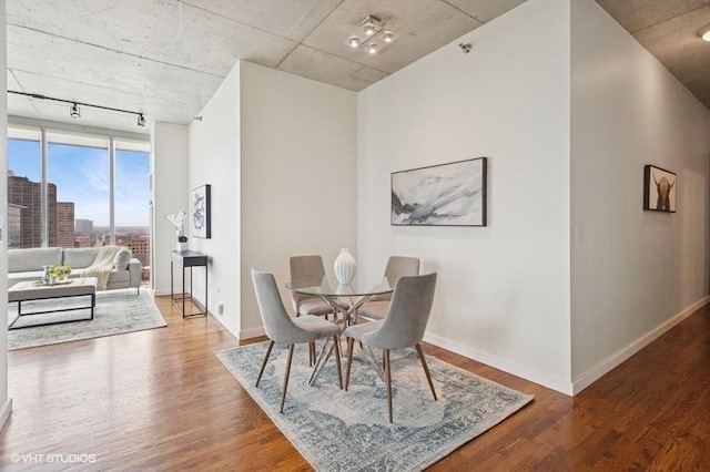 1720 S Michigan Ave Unit 1608, Chicago, IL 60616 - dining space featuring track lighting, wood finished floors, and baseboards