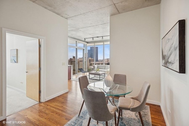 1720 S Michigan Ave Unit 1608, Chicago, IL 60616 - dining space featuring track lighting, wood finished floors, baseboards, and a view of city