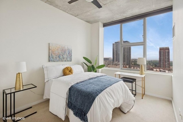 1720 S Michigan Ave Unit 1608, Chicago, IL 60616 - bedroom featuring baseboards, carpet flooring, a view of city, and ceiling fan