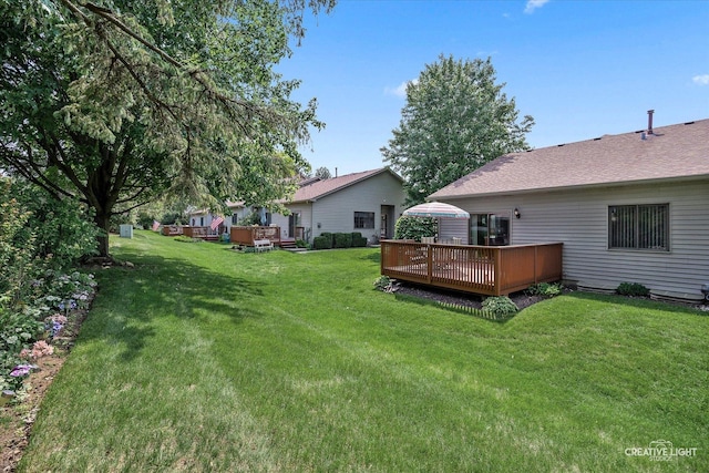 111 Fawn Ln, Elgin, IL 60120 - view of green lawn featuring a wooden deck