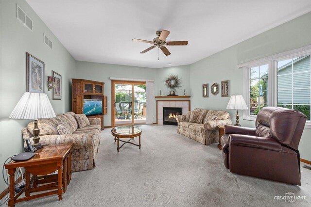 111 Fawn Ln, Elgin, IL 60120 - carpeted living area with a ceiling fan and a fireplace