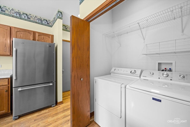 111 Fawn Ln, Elgin, IL 60120 - laundry area featuring separate washer and dryer and light wood finished floors