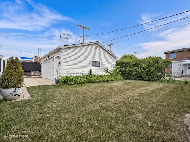 7215 W Foster Ave, Harwood Heights, IL 60706 - view of yard with driveway and an attached garage
