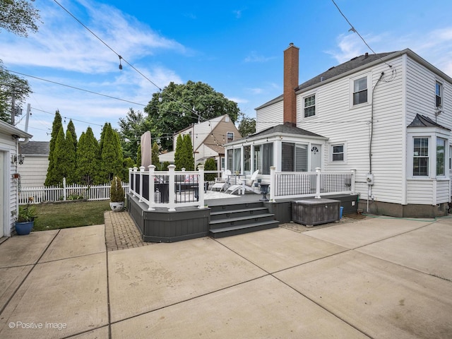 7215 W Foster Ave, Harwood Heights, IL 60706 - rear view of property featuring a hot tub, a patio, a chimney, and a deck