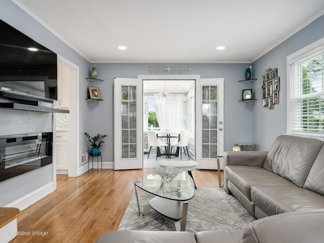 7215 W Foster Ave, Harwood Heights, IL 60706 - living room with a chandelier, ornamental molding, light wood-style flooring, and recessed lighting