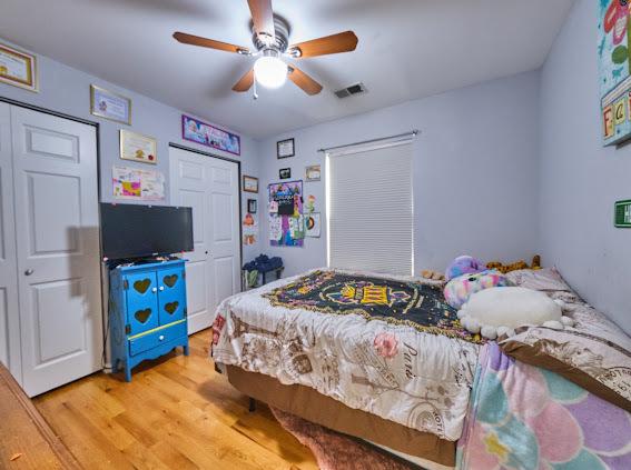4813 W 23rd St, Cicero, IL 60804 - bedroom with light wood-type flooring and a ceiling fan