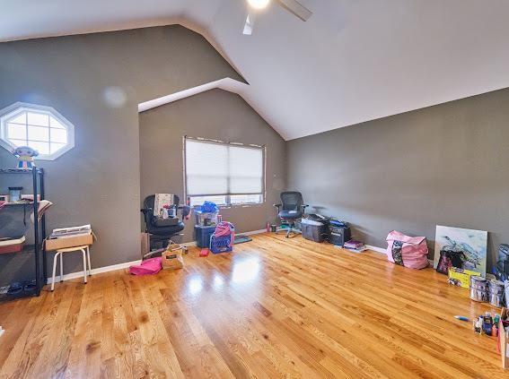 4813 W 23rd St, Cicero, IL 60804 - rec room with lofted ceiling, wood finished floors, and ceiling fan