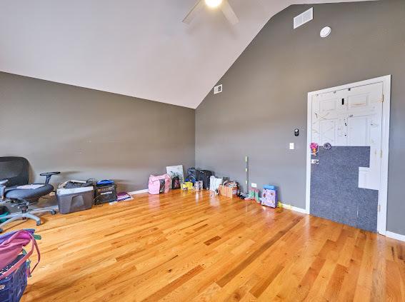 4813 W 23rd St, Cicero, IL 60804 - miscellaneous room with high vaulted ceiling, ceiling fan, and wood finished floors