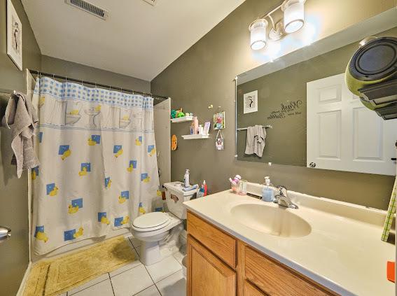 4813 W 23rd St, Cicero, IL 60804 - full bathroom featuring tile patterned floors, vanity, and curtained shower