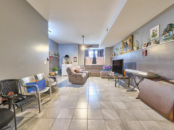 4813 W 23rd St, Cicero, IL 60804 - living area with ceiling fan and light tile patterned floors