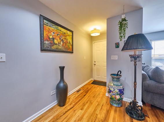 4813 W 23rd St, Cicero, IL 60804 - foyer entrance featuring baseboards and light wood-style flooring