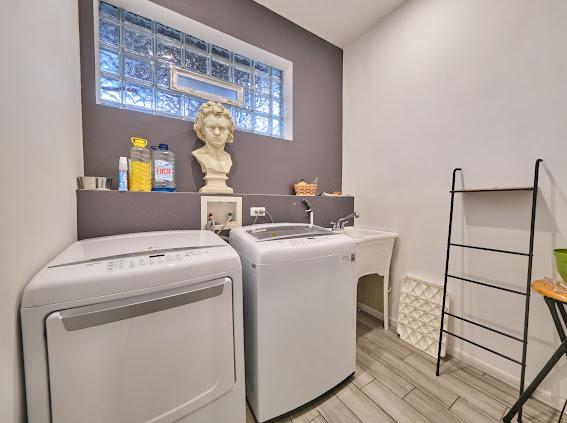 4813 W 23rd St, Cicero, IL 60804 - washroom with washer and clothes dryer and light wood-type flooring