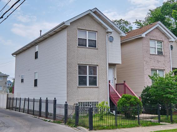 4813 W 23rd St, Cicero, IL 60804 - traditional-style house featuring brick siding and a fenced front yard
