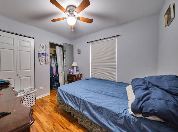 4813 W 23rd St, Cicero, IL 60804 - bedroom with wood finished floors and a ceiling fan