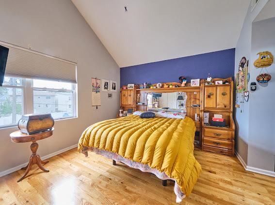 4813 W 23rd St, Cicero, IL 60804 - bedroom with vaulted ceiling and wood finished floors