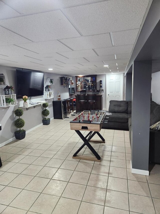 10806 S S Ave O, Chicago, IL 60617 - living area with bar area, light tile patterned flooring, and baseboards