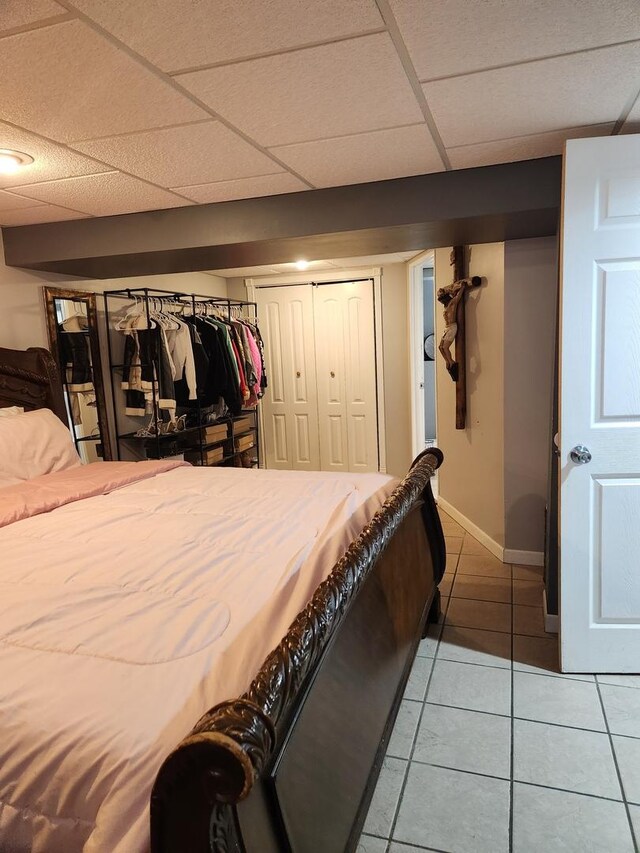 10806 S S Ave O, Chicago, IL 60617 - bedroom featuring a drop ceiling, baseboards, and tile patterned floors