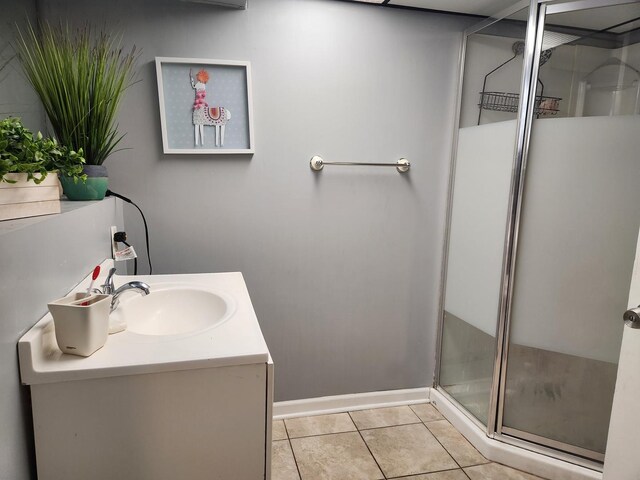 10806 S S Ave O, Chicago, IL 60617 - full bathroom featuring a stall shower, tile patterned floors, vanity, and baseboards