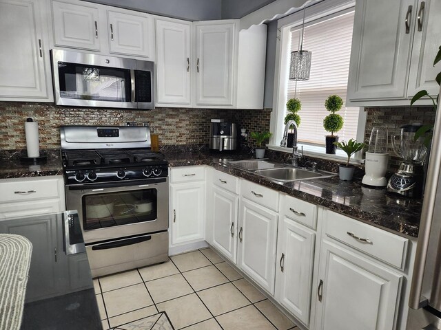 10806 S S Ave O, Chicago, IL 60617 - kitchen featuring appliances with stainless steel finishes, a sink, light tile patterned flooring, and white cabinets