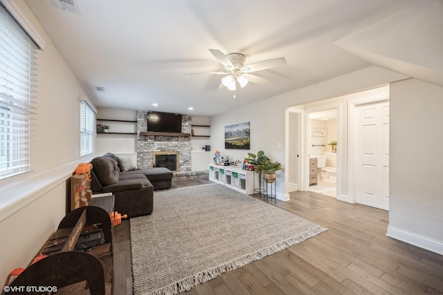 3925 Williams St, Downers Grove, IL 60515 - living area with a stone fireplace, wood finished floors, and a ceiling fan