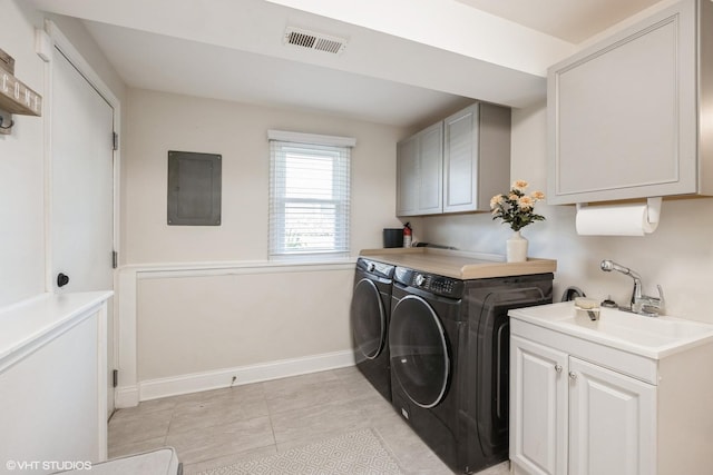 3925 Williams St, Downers Grove, IL 60515 - laundry area featuring electric panel, separate washer and dryer, and cabinet space