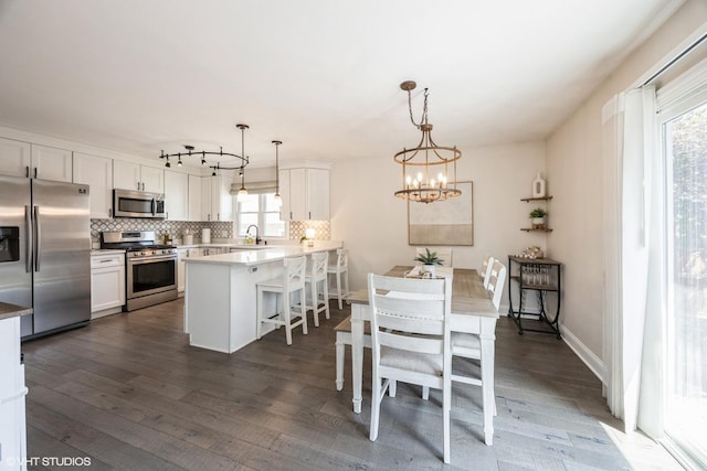 3925 Williams St, Downers Grove, IL 60515 - dining space with dark wood-style flooring and a chandelier