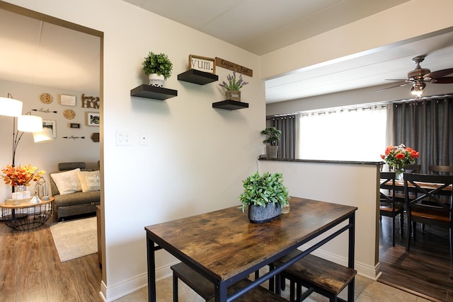 11114 Heritage Dr Unit 2D, Palos Hills, IL 60465 - dining area featuring a ceiling fan and wood finished floors