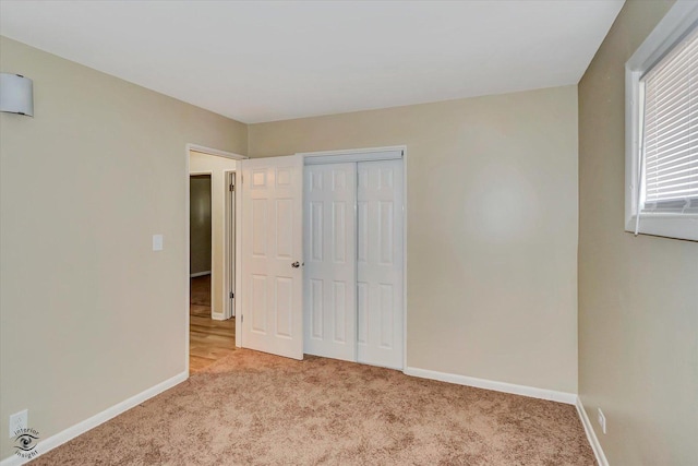 3102 Stafford Dr, Markham, IL 60428 - unfurnished bedroom featuring light colored carpet and a closet
