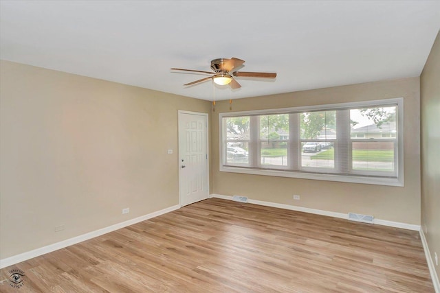 3102 Stafford Dr, Markham, IL 60428 - empty room with light wood-type flooring and a ceiling fan