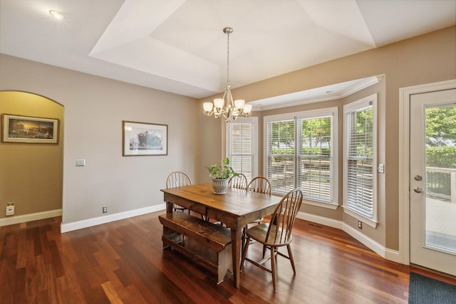 207 Quinlan Ave, Dekalb, IL 60115 - dining space featuring dark wood-type flooring and a chandelier