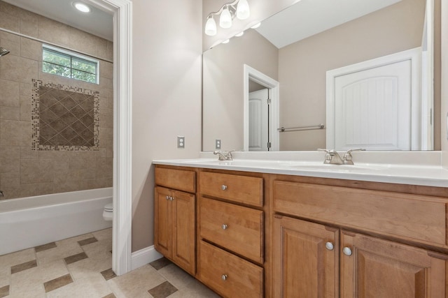 207 Quinlan Ave, Dekalb, IL 60115 - bathroom featuring double vanity and shower / tub combination