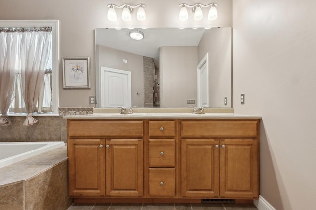 207 Quinlan Ave, Dekalb, IL 60115 - bathroom featuring double vanity, a bath, and tiled shower