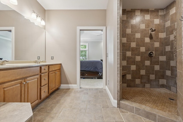 207 Quinlan Ave, Dekalb, IL 60115 - full bath featuring double vanity, tiled shower, ensuite bathroom, and stone finish floors