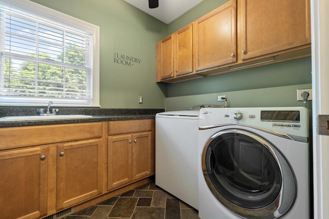 207 Quinlan Ave, Dekalb, IL 60115 - laundry room featuring washer and clothes dryer, cabinet space, and stone finish flooring