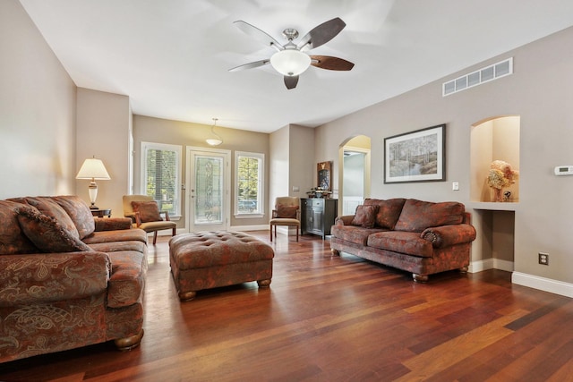 207 Quinlan Ave, Dekalb, IL 60115 - living room featuring arched walkways, ceiling fan, and wood finished floors