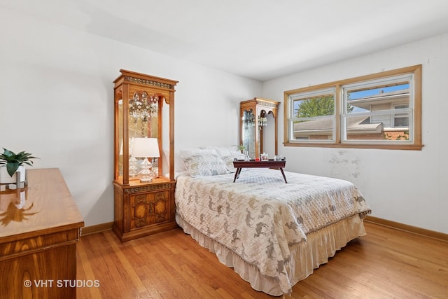 8544 W Roseview Dr, Niles, IL 60714 - bedroom with light wood-style flooring and baseboards