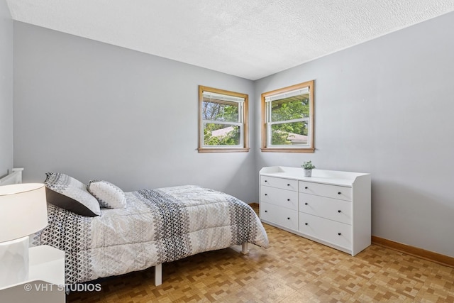 8544 W Roseview Dr, Niles, IL 60714 - bedroom featuring a textured ceiling and baseboards