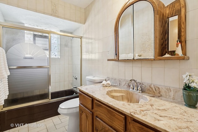 8544 W Roseview Dr, Niles, IL 60714 - bathroom with tile walls, vanity, bath / shower combo with glass door, decorative backsplash, and tile patterned flooring