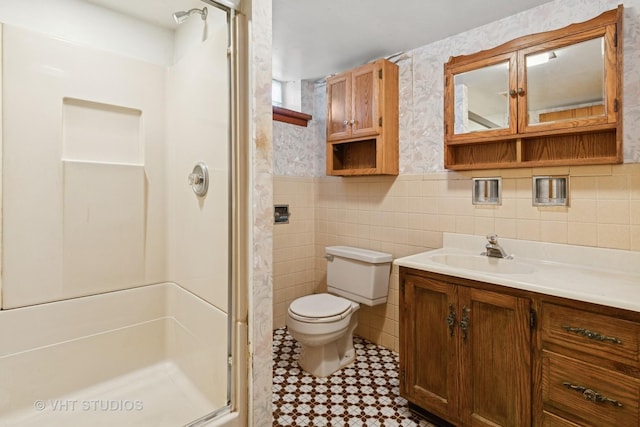 8544 W Roseview Dr, Niles, IL 60714 - bathroom featuring a shower stall, vanity, tile walls, and wainscoting
