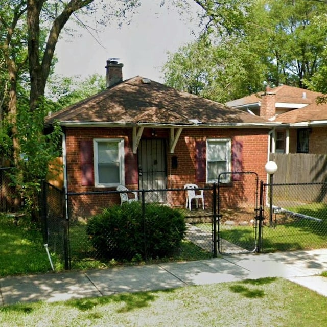 9620 S Eggleston Ave, Chicago, IL 60628 - bungalow with a chimney, brick siding, and a gate
