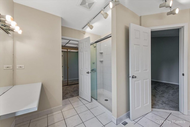 372 Goshawk Ln, Deerfield, IL 60015 - bathroom with tile patterned flooring, a stall shower, and track lighting