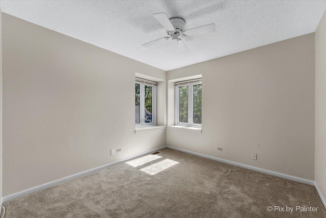 372 Goshawk Ln, Deerfield, IL 60015 - carpeted empty room with a textured ceiling and ceiling fan
