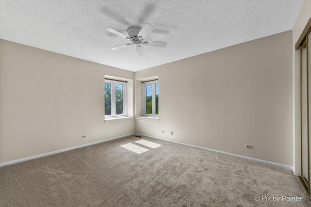 372 Goshawk Ln, Deerfield, IL 60015 - unfurnished room featuring a textured ceiling, carpet floors, and a ceiling fan