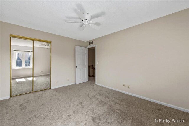 372 Goshawk Ln, Deerfield, IL 60015 - unfurnished bedroom featuring carpet flooring, a closet, and a ceiling fan